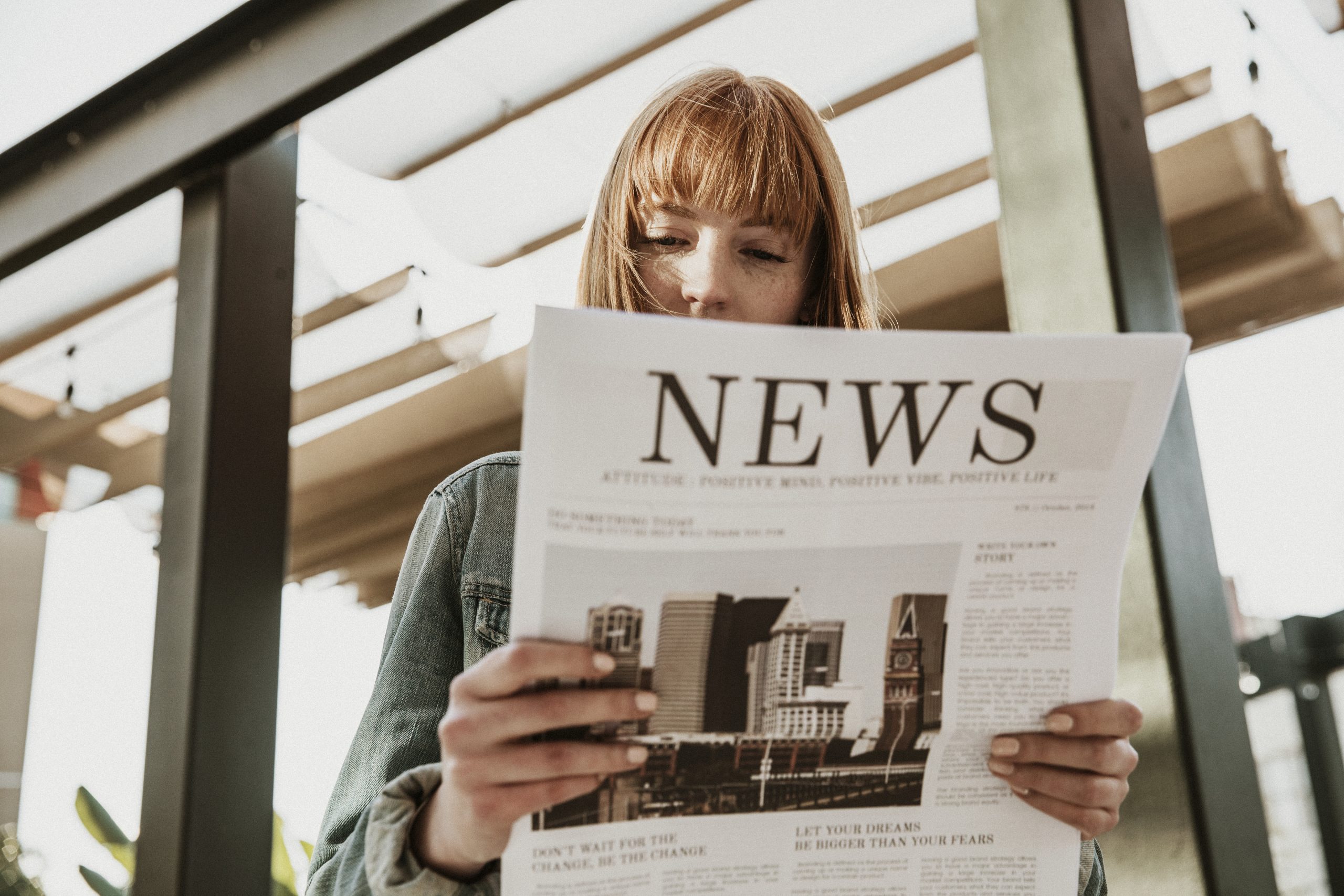 woman reading paper news 2023 11 27 04 50 07 utc scaled